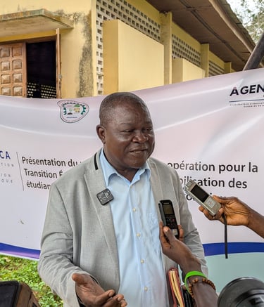 A Central African Republic official gives a press interview for CTE-RCA regarding ecological transition.
