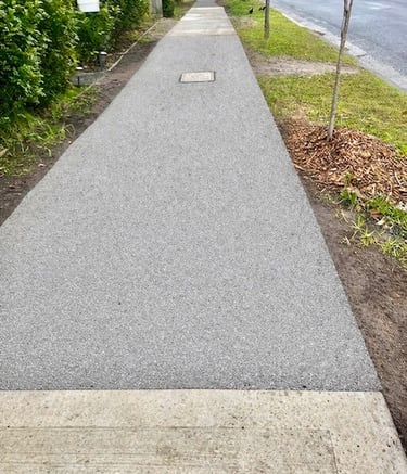 Permeable shared path paving designed to reduce root displacement and improve water infiltration in