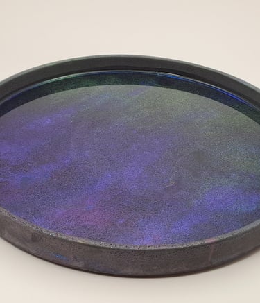 Handmade circular gypsum tray featuring a galaxy-inspired purple and blue resin inlay.