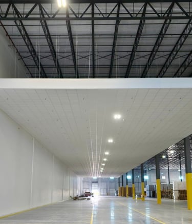 Large-scale acoustic ceilings installation for industrial warehouse in Florida.