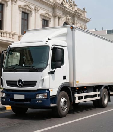 A professional white logistics truck with a clean design parked on a wide street in Lima. South American architecture in the background, bright sunny day, sharp focus, crisp white and dark navy blue color palette.