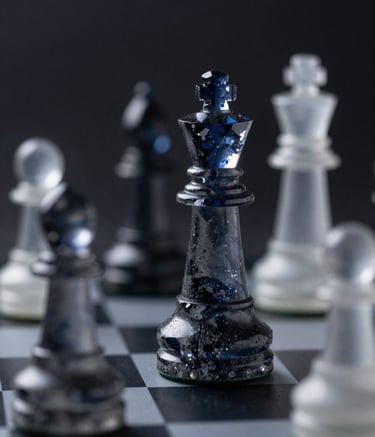 A macro shot of a chessboard where the pieces are abstract, crystalline shapes. One piece is in sharp focus, illuminated by a sliver of light against a dark, professional background. The style is sophisticated and intellectual, using a palette of deep navy and charcoal grey in a North American / US context.