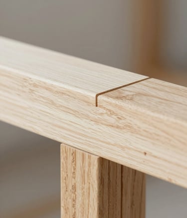 A close-up macro shot showcasing the meticulous detail of a perfectly joined timber joint in a modern home extension. The wood grain is rich and clean, highlighting refined craftsmanship. The lighting is bright and professional, utilizing a palette of #FFFFFF and soft #222222 shadows to emphasize quality workmanship.