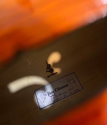 Daylight peers through the cello soundholes and reflects onto the brand and label inside.