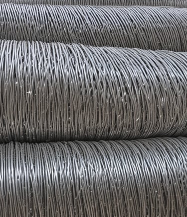 Close-up of high-quality galvanized wire mesh production process in factory setting.