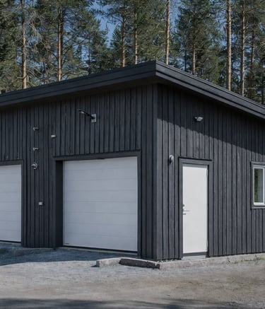 A garage painted in grey with heritage barn paint