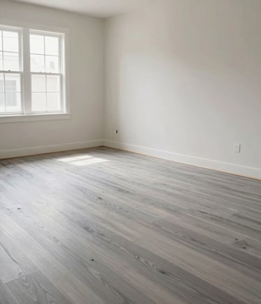 Modern interior of a renovated North American / New Mexican living room, showing professional painting and floor remodeling. Soft natural light, high-end finish, Silver and Off-White palette, emphasizing a clean and reliable transformation.