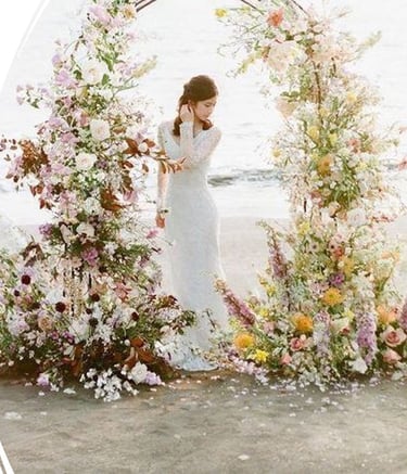 Beach wedding ceremony setup with floral arch and elegant decor in Bodrum