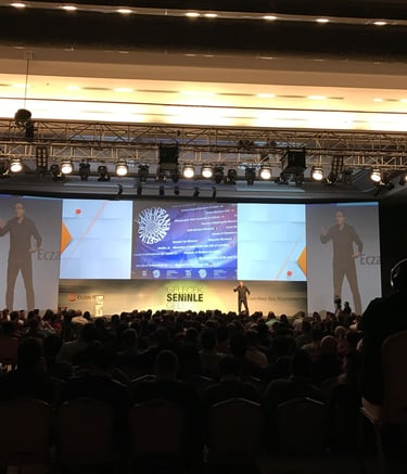 Corporate conference event production with professional sound, lighting, and large screen presentati