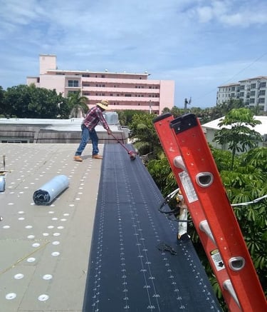 working on a commercial built up tapered flat roof.