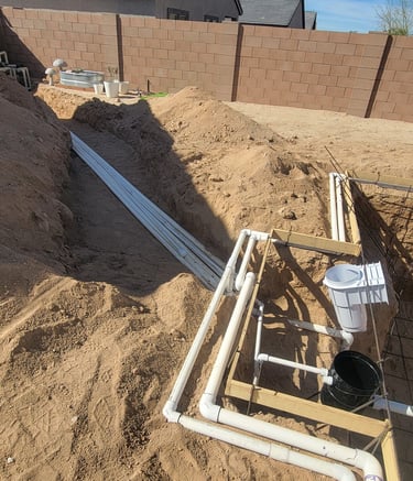 a pipe pipe is shown in the foreground of a house