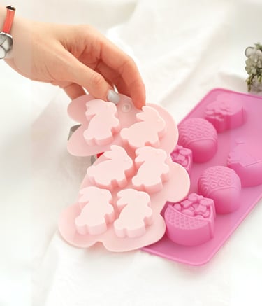 a person holding a pink plastic mold mold mold mold mold mold mold mold mold mold