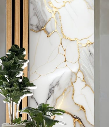 Modern interior design featuring white marble wall art with gold veins and indoor potted plants.