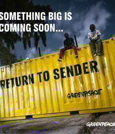 a man sitting on a container container with another man standing on the side of the