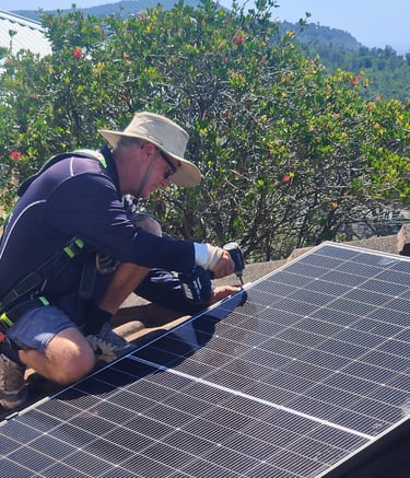 a man installing a solar panel