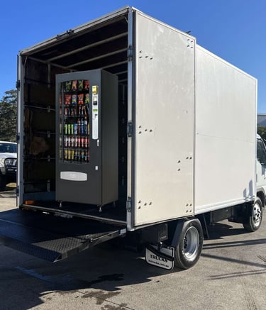 vending machine transport pantech truck with a tailgate loader with combination vending machine