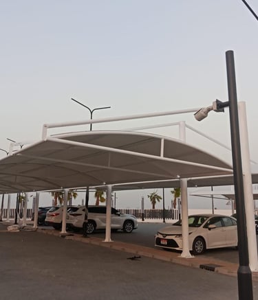 Powder-coated mild steel parking shade structure with high-quality PVC fabric.