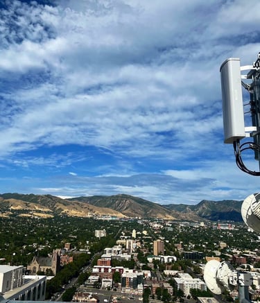 a cell phone phone tower with a antenna on top of it