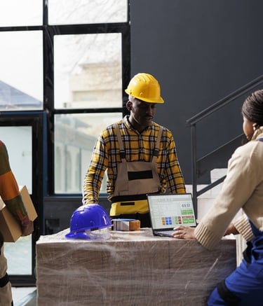 a group of people standing around a table