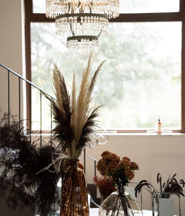wedding table with a chandelier and flowers