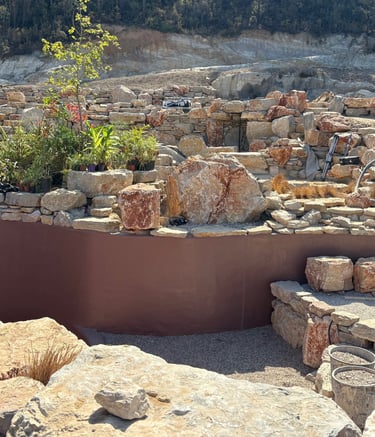 Natural pool with multiple levels, custom-colored walls & artisan stonework | Aqua Vitae build