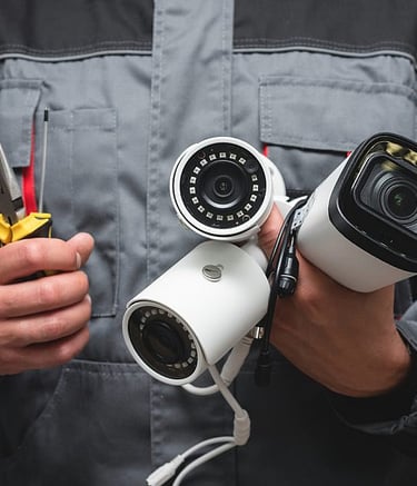 a man in a blue jacket holding a camera and a camera