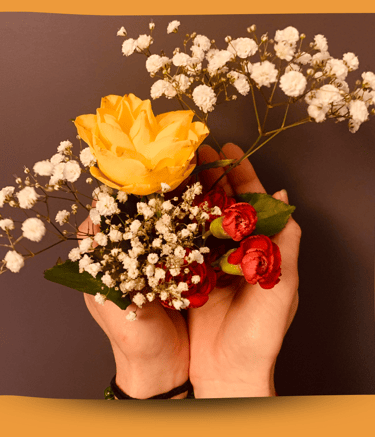 Martina holding flowers in her hands