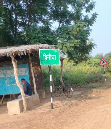 two person sit on the roadside