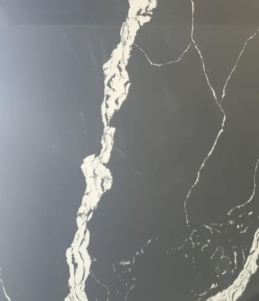 Black quartz slab with polished finish and reflective surface