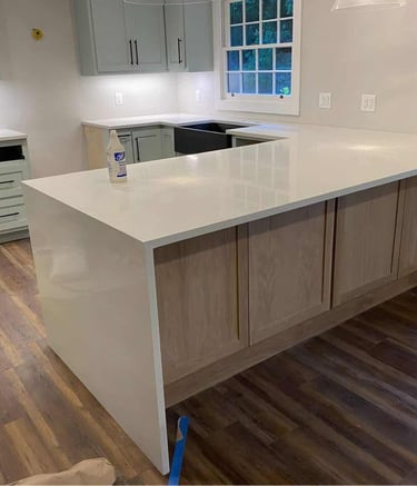 Waterfall countertop design with seamless stone flow