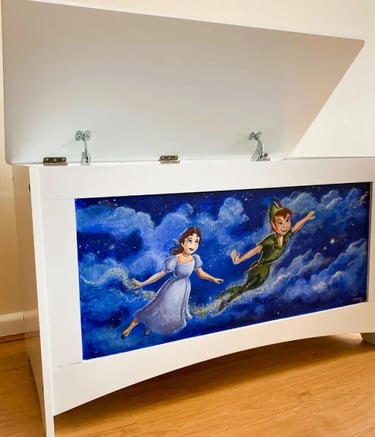 Angled white toy chest hand-painted with characters and a midnight blue, starry sky.