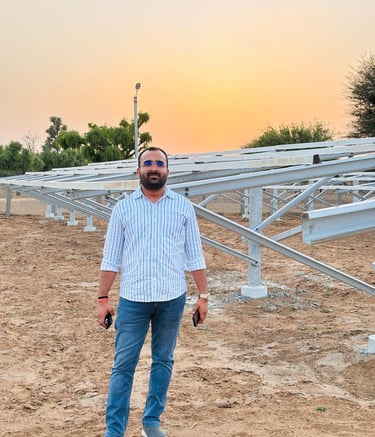 a man with a camera and a camera in front of a solar array