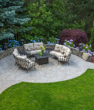 a patio with a fire pit and a fire pit