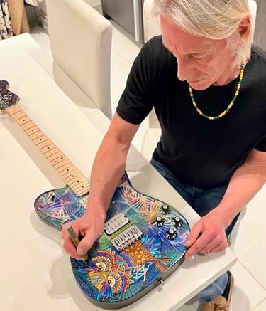 Paul Weller of the Jam - autographing my hand painted guitar. Graffiti-Garage
