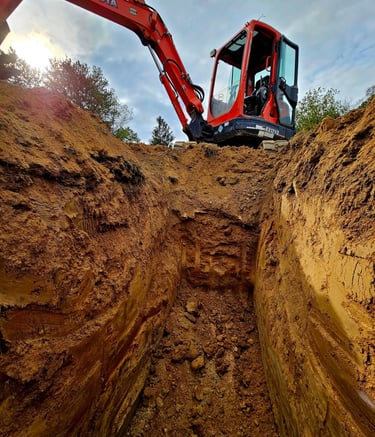 a construction worker is working on a trench