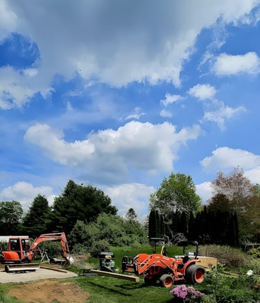 a tractor with a tractor trailer parked in a field