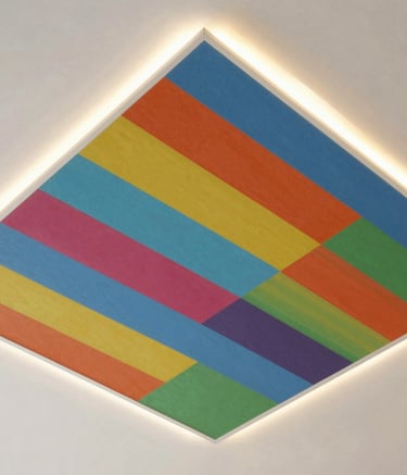 Finished ceiling with intricate plaster designs illuminated by warm ambient light.