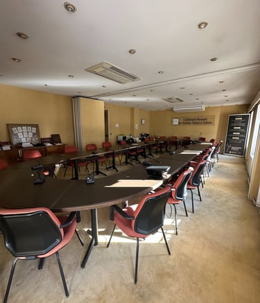 a conference room with a long table and chairs