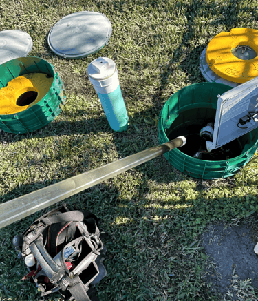 a home septic system being inspected and serviced