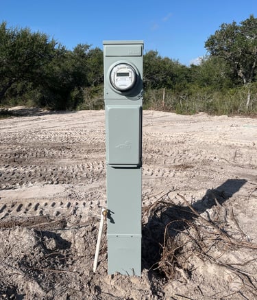a cleared lot of land with an RV meter installed