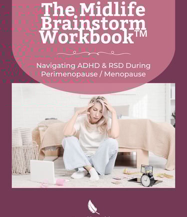 a woman sitting on a bed with a laptop and a clock