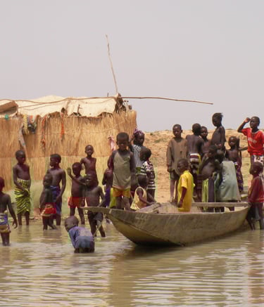 Niger River Village by Sarah Liptrot