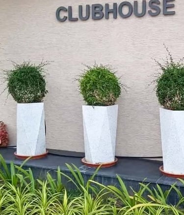 Artistic pottery accents in a heritage-inspired courtyard design by Garden Designers