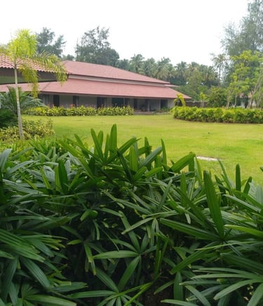 Farmhouse landscape blending rustic charm with native flora by Garden Designers