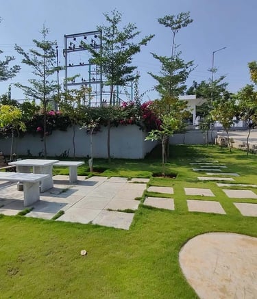 Industrial facility landscape with hardy shrubs and erosion control by Garden Designers