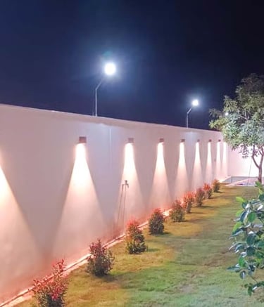 Ambient outdoor lighting creating a cozy night-time garden vibe by Garden Designers