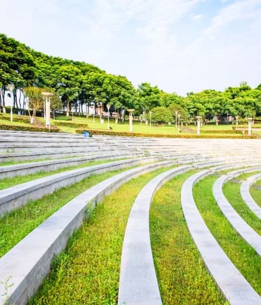 Peaceful temple surroundings designed with traditional elements and foliage by Garden Designers