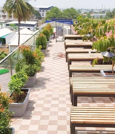 Lush rooftop terrace landscape with shade and ornamental greens by Garden Designers