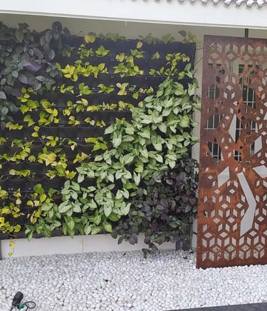 Fresh and vibrant vertical garden installation on a wall by Garden Designers