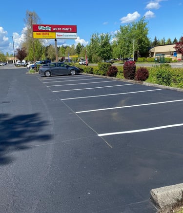 Parking lot sealcoating and striping OReilly Auto Parts Thurston County WA